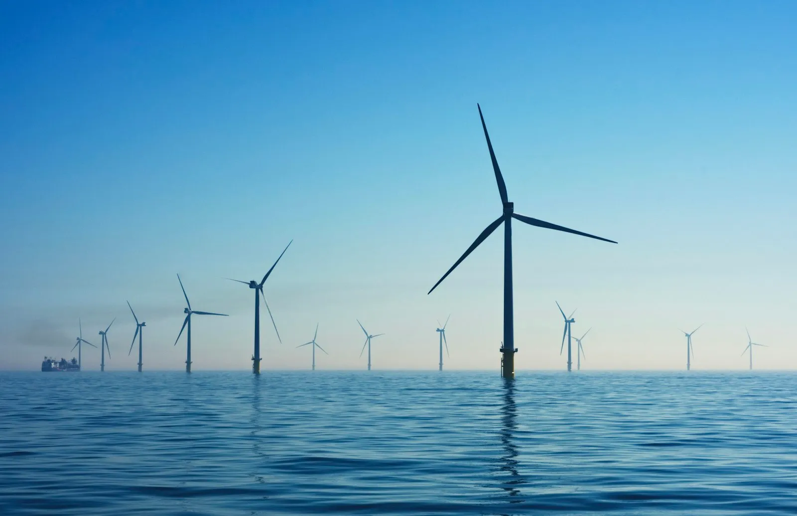 Offshore wind turbines standing in a calm sea